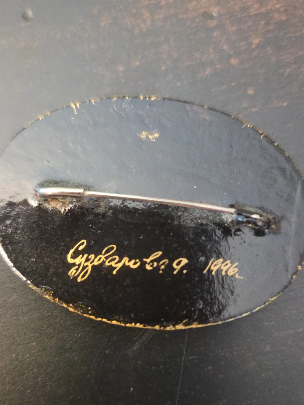Vintage '96 Oval Black Floral Brooch with Gold Accents